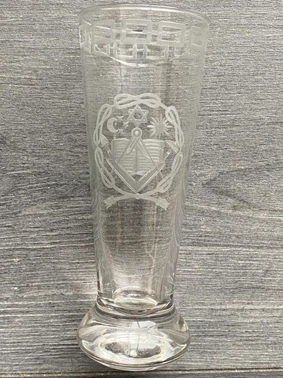 Stemmed glass with engraved symbols of the...