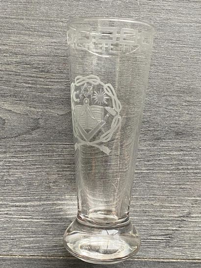 Stemmed glass with engraved symbols of the...