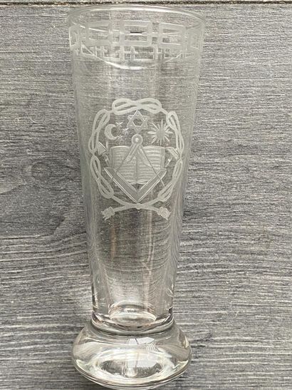 Stemmed glass with engraved symbols of the...