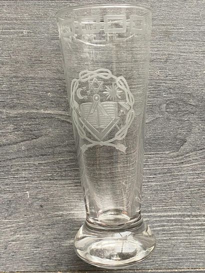 Stemmed glass with engraved symbols of the...