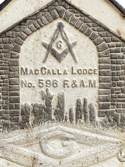 White and gray commemorative cast-iron plaque...