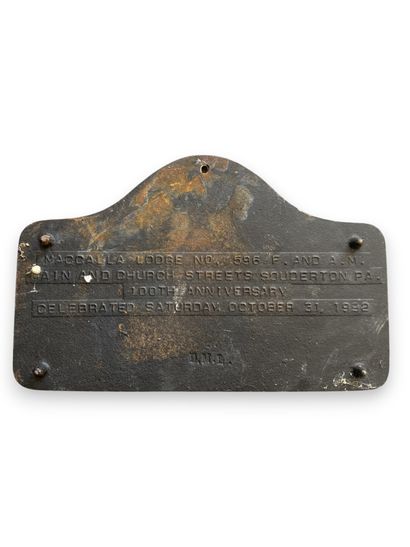 White and gray commemorative cast-iron plaque...