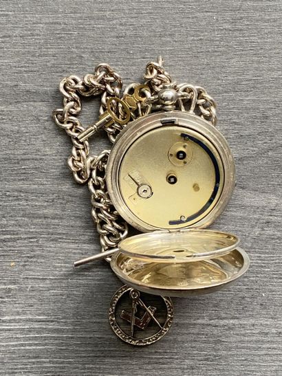 A round steel masonic pocket watch with a...