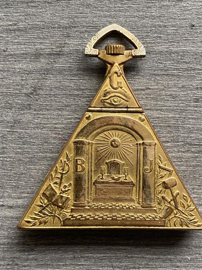 A masonic pocket watch in gilded metal, triangular...