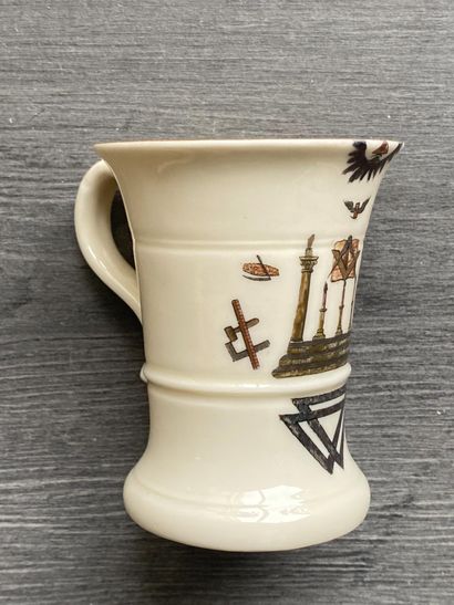 A porcelain goblet with gilded rim and painted...