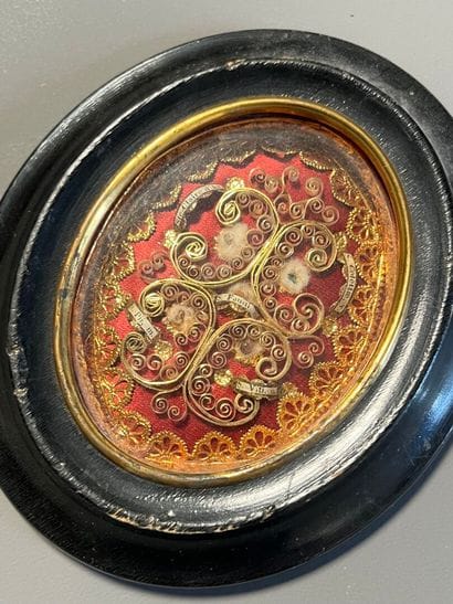 [Paperolle-reliquaire]. Four relics including...