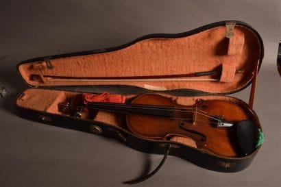 A violin and its bow in a black case