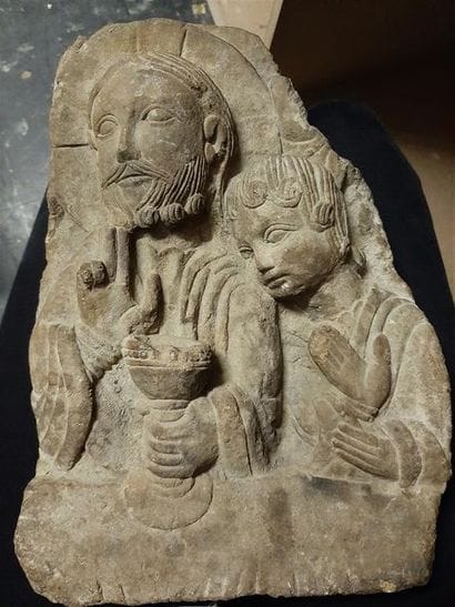 A bas-relief in Romanesque style Last Supper...