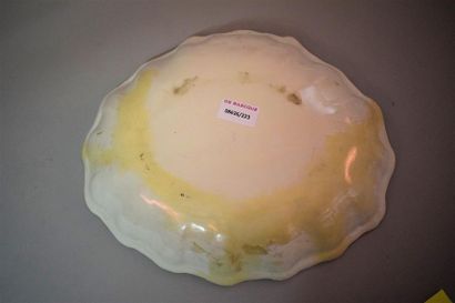 An oblong earthenware bowl with ochre decoration...