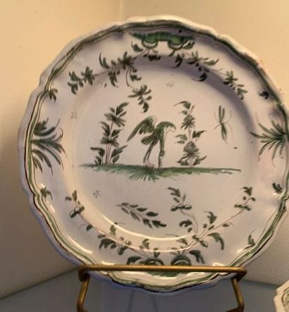 Four Moustier earthenware plates, decorated...