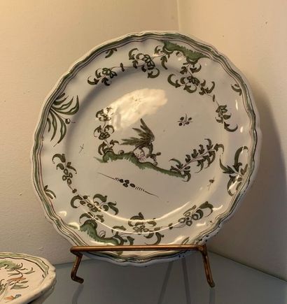 Four Moustier earthenware plates, decorated...