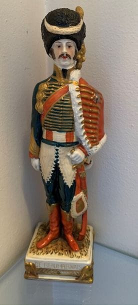 Two polychrome porcelain figurines. One of...
