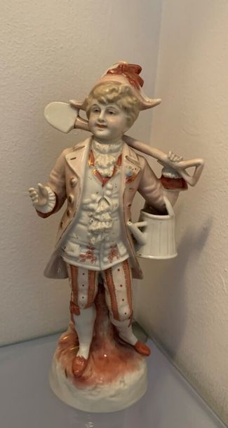 Two polychrome porcelain figurines. One of...