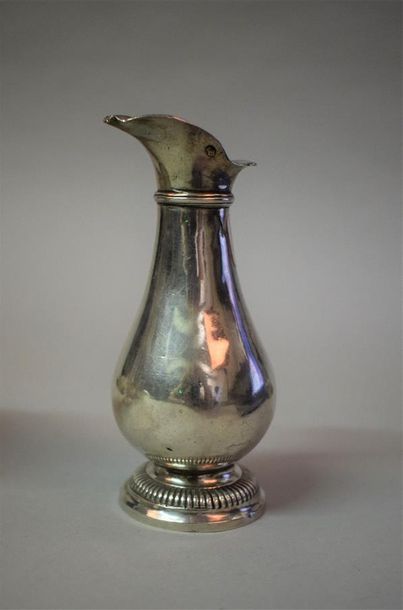 Plain silver water cruet, engraved A, resting...