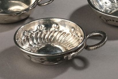 A set of three wine cups: - Silver wine cup...