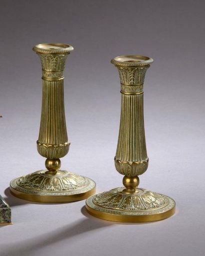 Pair of small low bronze candleholders decorated...