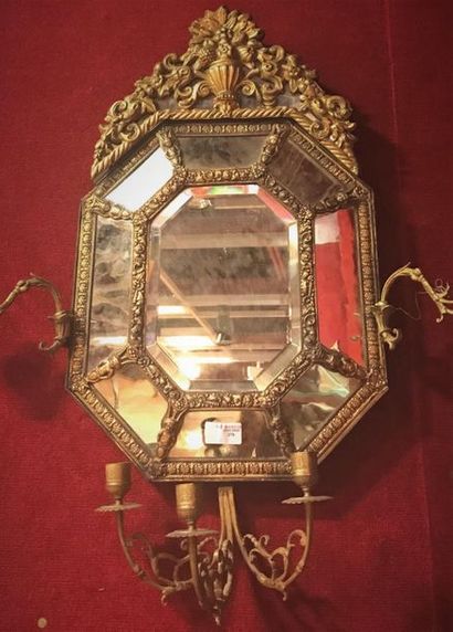 Mirror with octagonal pediment in a double...