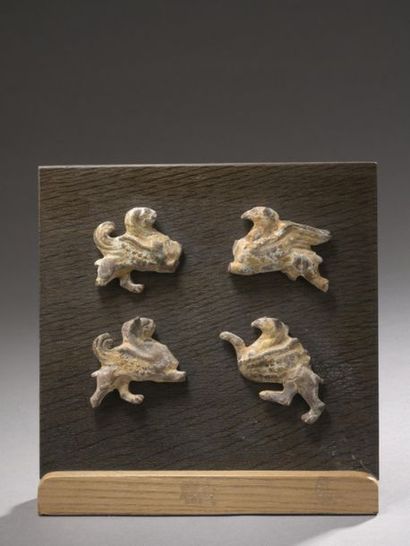 Set of four wall lights in the shape of griffins...