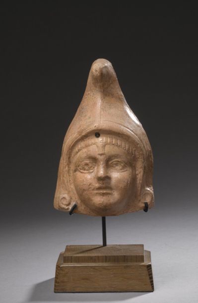 Child's head capped with a high hood revealing...