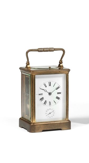 Pendulette de voyage en laiton doré (usures)...