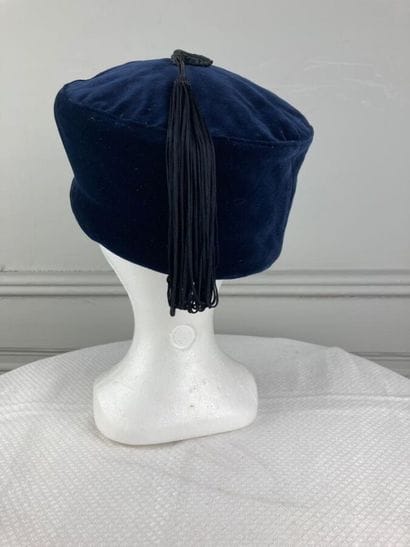 STEPHEN JONES

Navy velvet tarbouche hat...