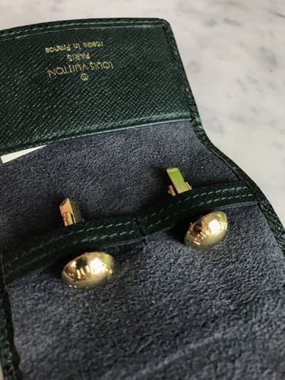 LOUIS VUITTON

Lot including a pair of gilded...