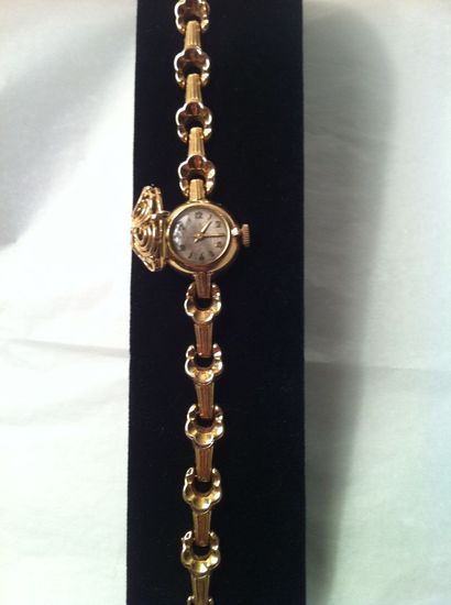 Bracelet montre de dame en or jaune, cadran...