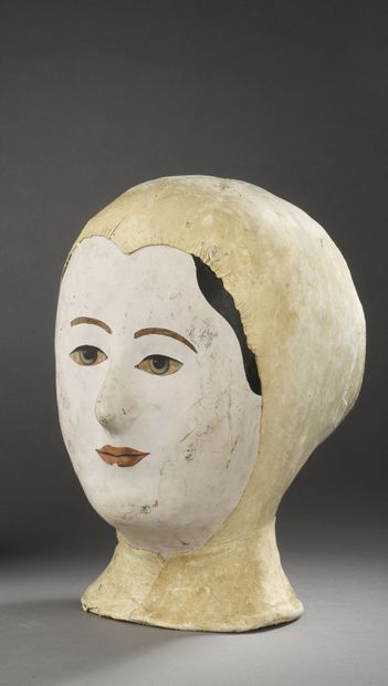 Milliner's marotte, featuring a young woman
Late...