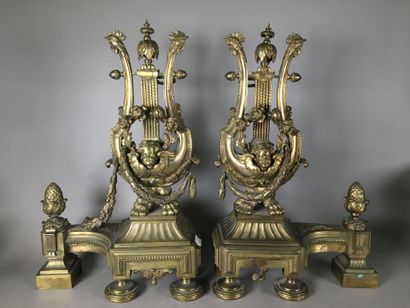 Paires de chenets en bronze à décor de lyres...