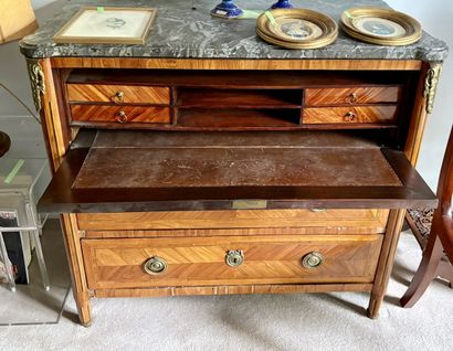 A satin-finish veneered COMMODE opening with...