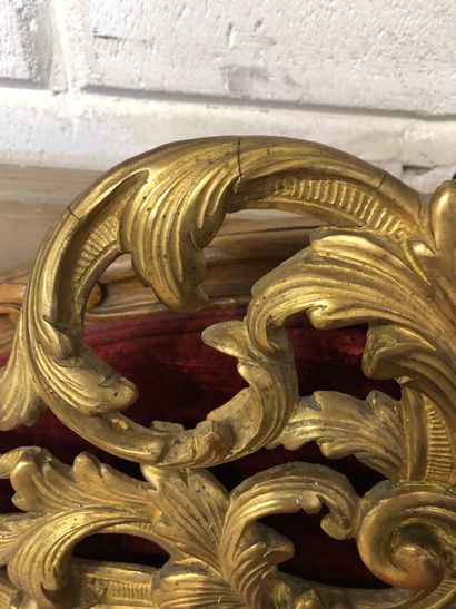 Mirror in a pedimented frame in gilded wood...
