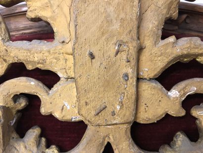 Mirror in a pedimented frame in gilded wood...