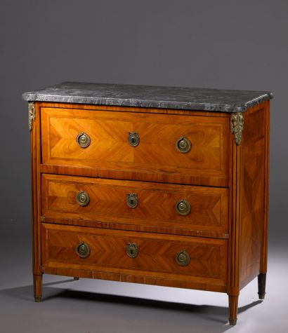 A satin-finish veneered COMMODE opening with...
