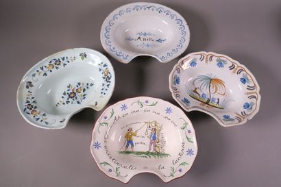 Réunion de plats à barbe en faïence polychrome...