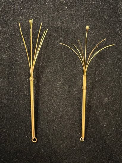 Two 18K (750‰) gold champagne stirrers, one...