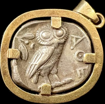 Pendant containing an antique silver coin:
ATTIC...