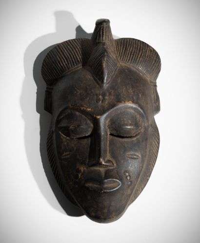 BAOULÉ, CÔTE D'IVOIRE
Masque en bois à patine...