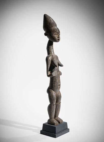 # KOULANGO, CÔTE D'IVOIRE
Statue féminine...