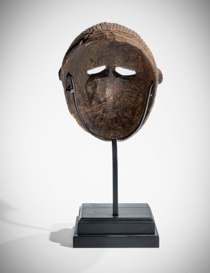 # BAMBARA, MALI
Masque en bois dur à patine...