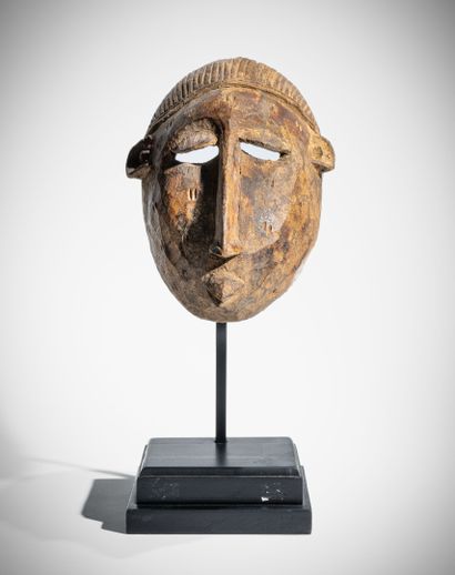 # BAMBARA, MALI
Masque en bois dur à patine...