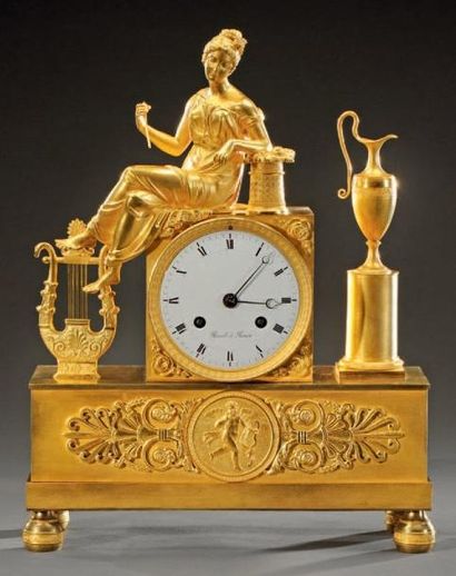 Pendule borne en bronze doré à sujet de jeune...
