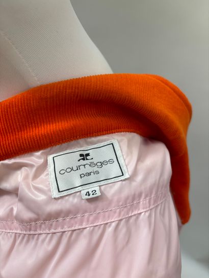 Courrèges
Pink speckled tweed suit featuring...