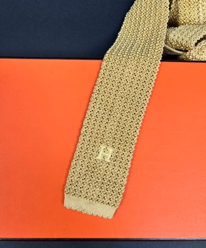 Hermès Paris
Mustard silk knit tie, monogrammed...