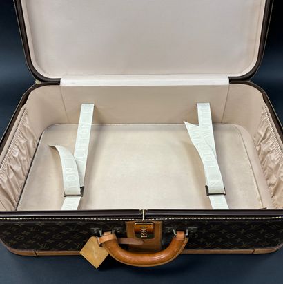 Louis Vuitton 
Stratos suitcase 
In monogrammed...