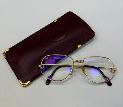 Cartier
Pair of glasses 
Gilded brass fr...