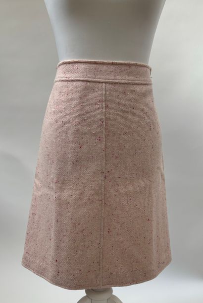 Courrèges
Pink speckled tweed suit featuring...