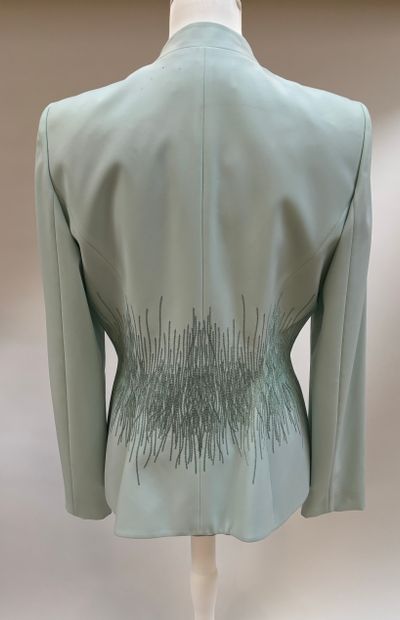 Thierry Mugler
Ice-blue polyester suit featuring...