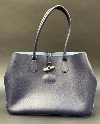 Longchamp
Blue leather tote bag, sky lining,...