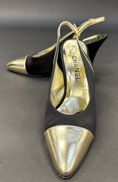 Chanel 
Pair of black satin pumps with gold...