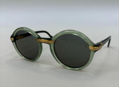 Cartier
Pair of green marbled resin sunglasses,...